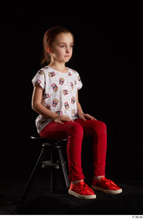 Lilly  1 dressed red leggings red shoes sitting t…